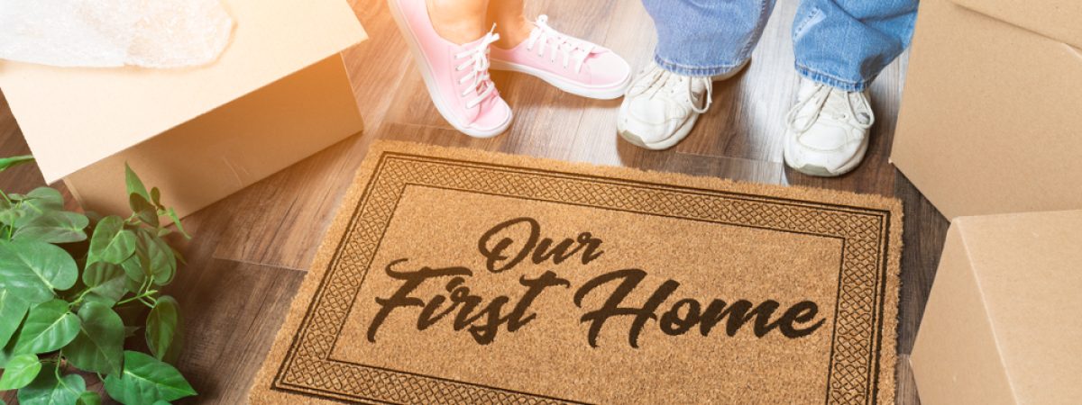 Man,And,Woman,Unpacking,Near,Our,First,Home,Welcome,Mat,